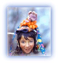 Brokma girl in traditional head dress. Credit: Discover India