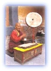 The Buddhist Lama strikes the gong during rituals. Credit: Discover India