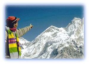 Tenzing Norgay points to that magical summit. Credit: Stan Armington